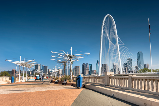 Dallas, Texas, USA - November 13, 2021:  Margaret Hunt Hill Bridge and the pedestrian only Ronald Kirk Bridge crosses over the Trinity River leading into Dallas Texas USA