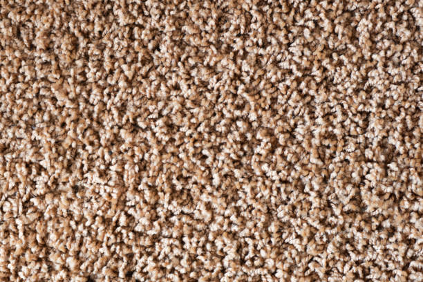 istock Brown carpet texture. Closeup fiber background. Soft plush fabric pattern. 1472146881