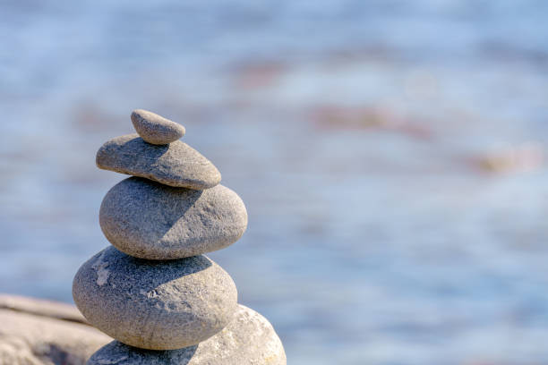 istock Pyramid of stones. Unstable balance of stone objects. 1472150271