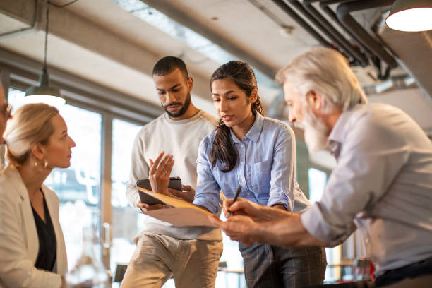 istock Business people having a meeting in a restaurant 1472150273