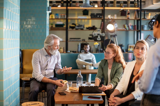 istock Business people having a meeting in a restaurant 1472150442
