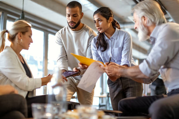 istock Business people having a meeting in a restaurant 1472150943
