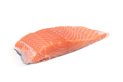 Raw salmon slice isolated on white background