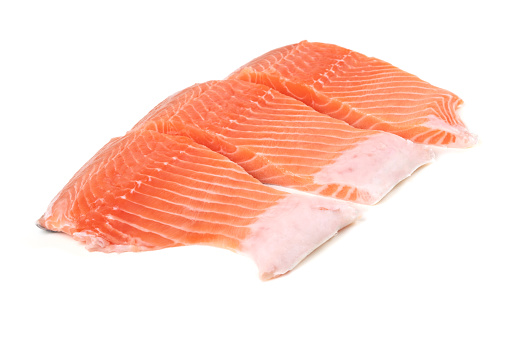 Raw salmon slices isolated on white background