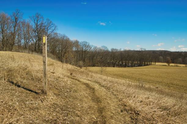 istock Trail Marker on Hill by Field 1472152378