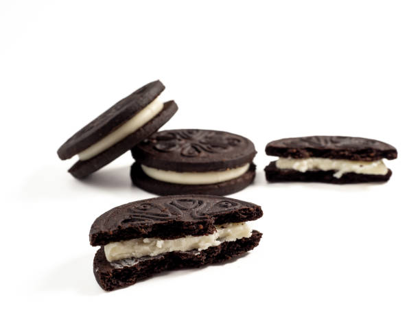 istock Black tasty cookies isolated on white background. 1472152965