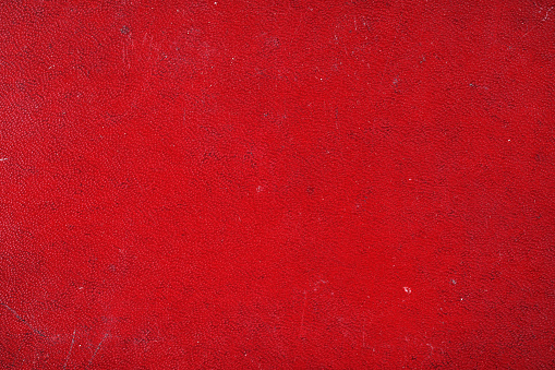 Old rough red leather background texture, marked