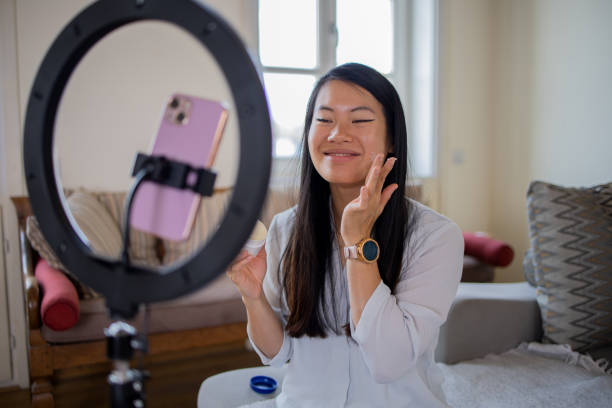 istock Smiling influencer records her podcast 1472154580