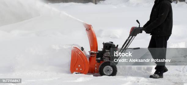 A Portable Snow Blower Powered By Gasoline Stock Photo - Download Image Now - Snowblower, Agricultural Machinery, Blizzard