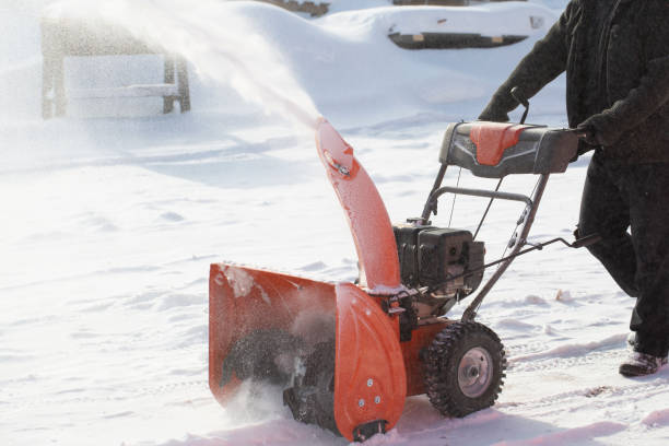 istock A portable snow blower powered by gasoline. 1472157319