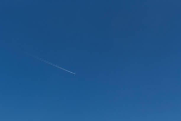 istock Airplane in the sky 1472158313