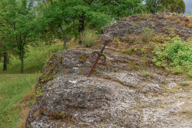 istock sword stuck in the rock 1472158568