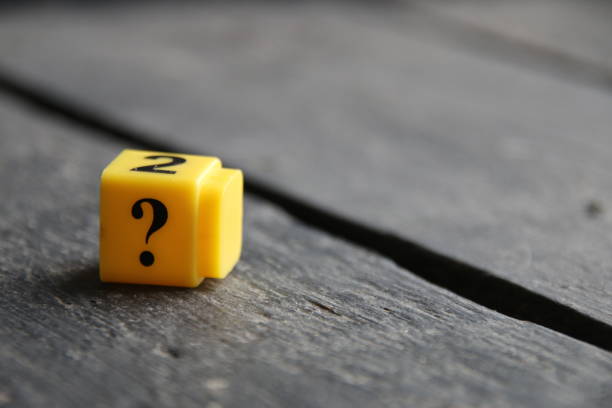 istock Question mark on a wooden background.. 1472159031