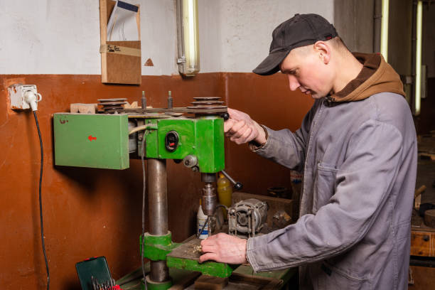 istock A carpenter works in a workshop with a saw, planer and various tools 1472161713