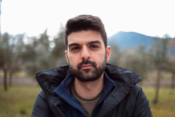 Portrait of a young man at the park.