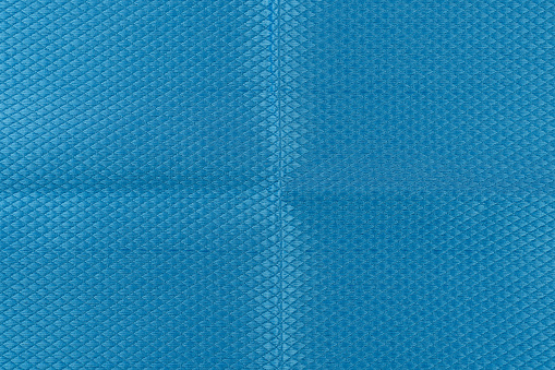 Blue microfiber rag for polished surfaces with abrasive effect, close up.