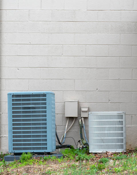 istock Two Old Air Conditioning Units Outside Repair Shop With Copy Space 1472163601