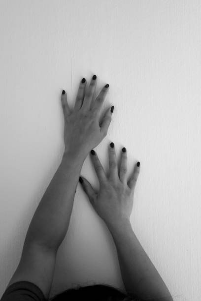 istock a pair of female hands crawled on the wall. 1472163774