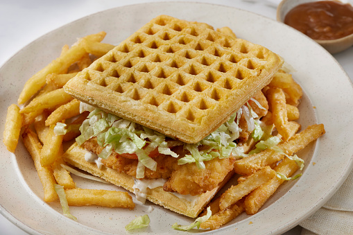 Fried Chicken Tender Waffle Sandwich with Lettuce, Tomato, Mayo, Fries and Gravy