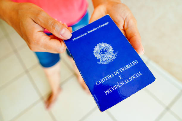 istock A safe woman Work and Social Security Card (Carteira de Trabalho) seen displayed. It is the document that guarantees access to the rights of the Brazilian worker. 1472169151