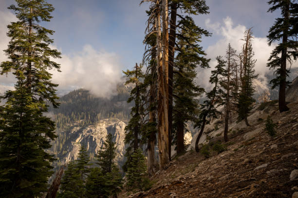 istock Cloud Puffs Waft through the Canyon along the Watchtower Trail 1472169476