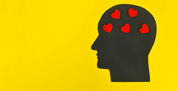 istock Silhouette of a man's head with hearts. copy space 1472169565