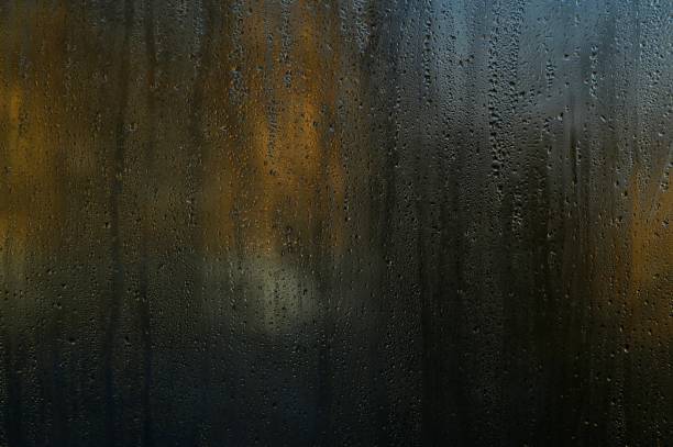 istock wet glass. drops on the window glass 1472169700