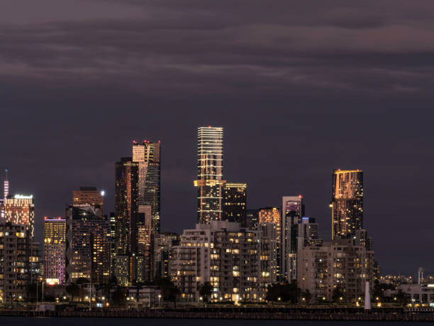 istock Urban skyline and water at sunset 1472170561