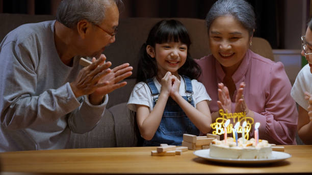 istock Family celebrating birthday with happiness 1472170574