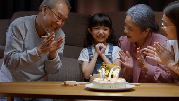 istock Family celebrating birthday with happiness 1472170629