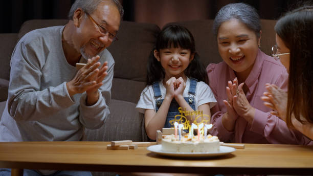istock Family celebrating birthday with happiness 1472170679