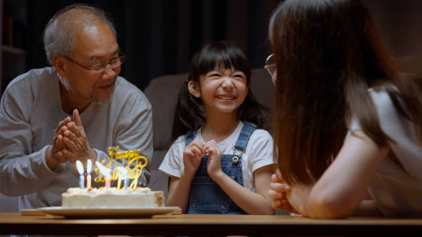 istock Family celebrating birthday with happiness 1472170721