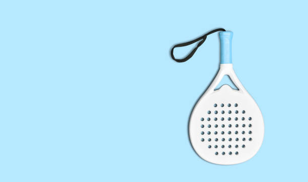 istock White professional paddle tennis racket on blue background. Horizontal sport theme poster, greeting cards, headers, website and app 1472171411