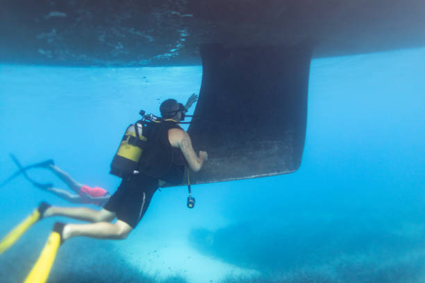 a diver and a sunken plane on the island of Aruba