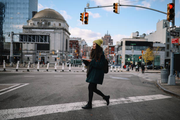istock commuter having a pizza slice on the go in NYC 1472179298