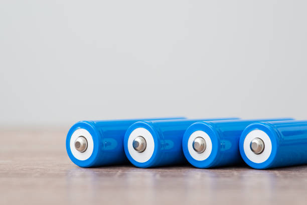 istock Modern blue batteries laying on the table 1472180566