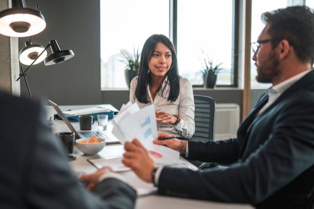 istock Handsome Office Employees Working In A Bank's Office 1472186922