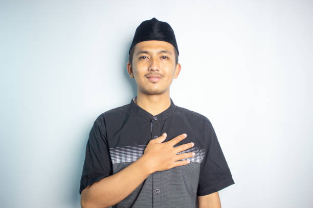 istock Smiling young Asian man wearing islamic shirt 1472189995