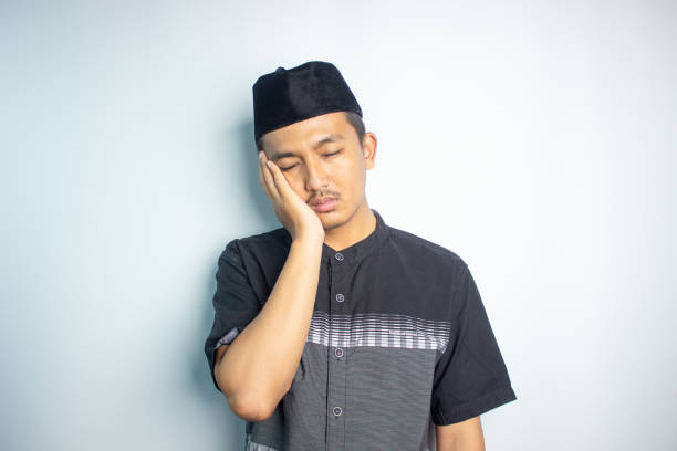 istock Smiling young Asian man wearing islamic shirt 1472190064