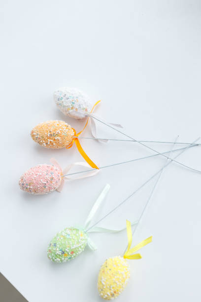 istock Easter toys. Wooden Easter eggs on white background, copy space. 1472190858