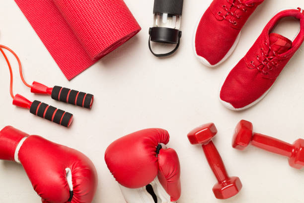 istock Red sport equipment on concrete background, top view 1472197044
