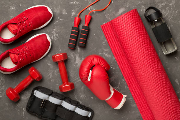 istock Red sport equipment on concrete background, top view 1472197050