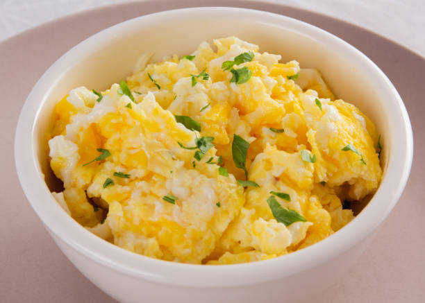 istock Scrambled Eggs with Seasonings in Bowl 1472204580