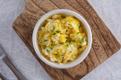 Wholesome Scrambled Eggs with Fresh Seasonings in Bowl