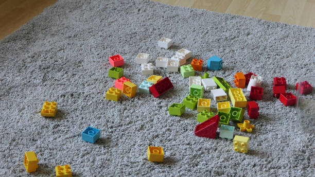 istock Mix of Colourful bricks sitting on mat indoors 1472207231