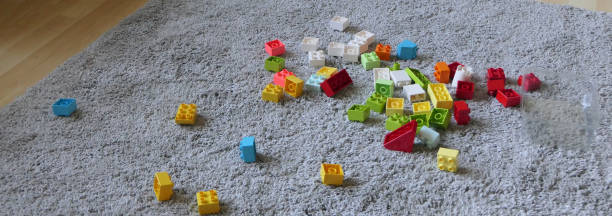 istock Mix of Colourful bricks sitting on mat indoors 1472207235