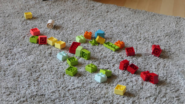 istock Mix of Colourful bricks sitting on mat indoors 1472207241