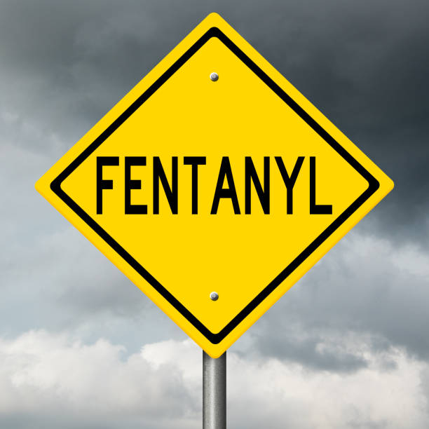 Diamond shaped warning sign for FENTANYL Yellow highway warning sign relating to substance abuse fentanyl addiction stock pictures, royalty-free photos & images