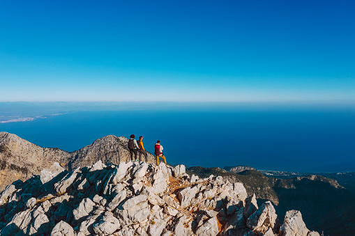 Summiteers at the mountain peak, drone point of view