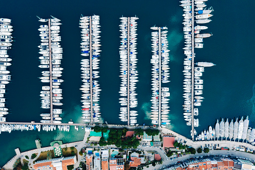 Monte-Carlo, Monaco - April 16, 2023: Aerial view of luxurious superyachts lined up at Port Hercule in Monte-Carlo, Monaco, prior to the Formula 1 Grand Prix